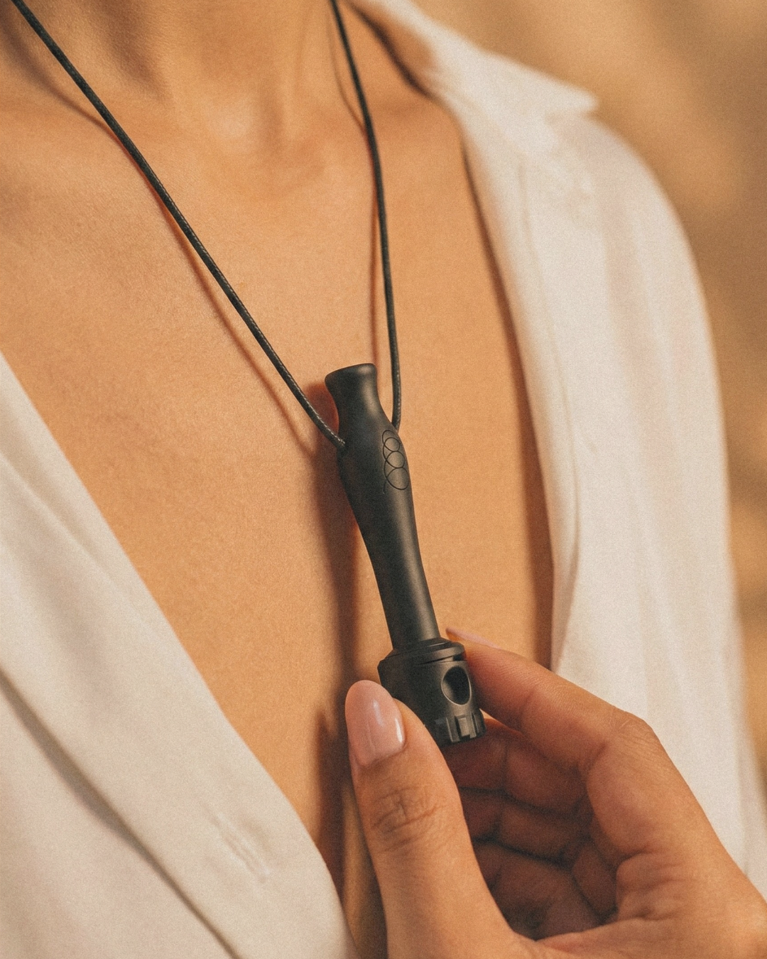 Resono Go worn on a cord