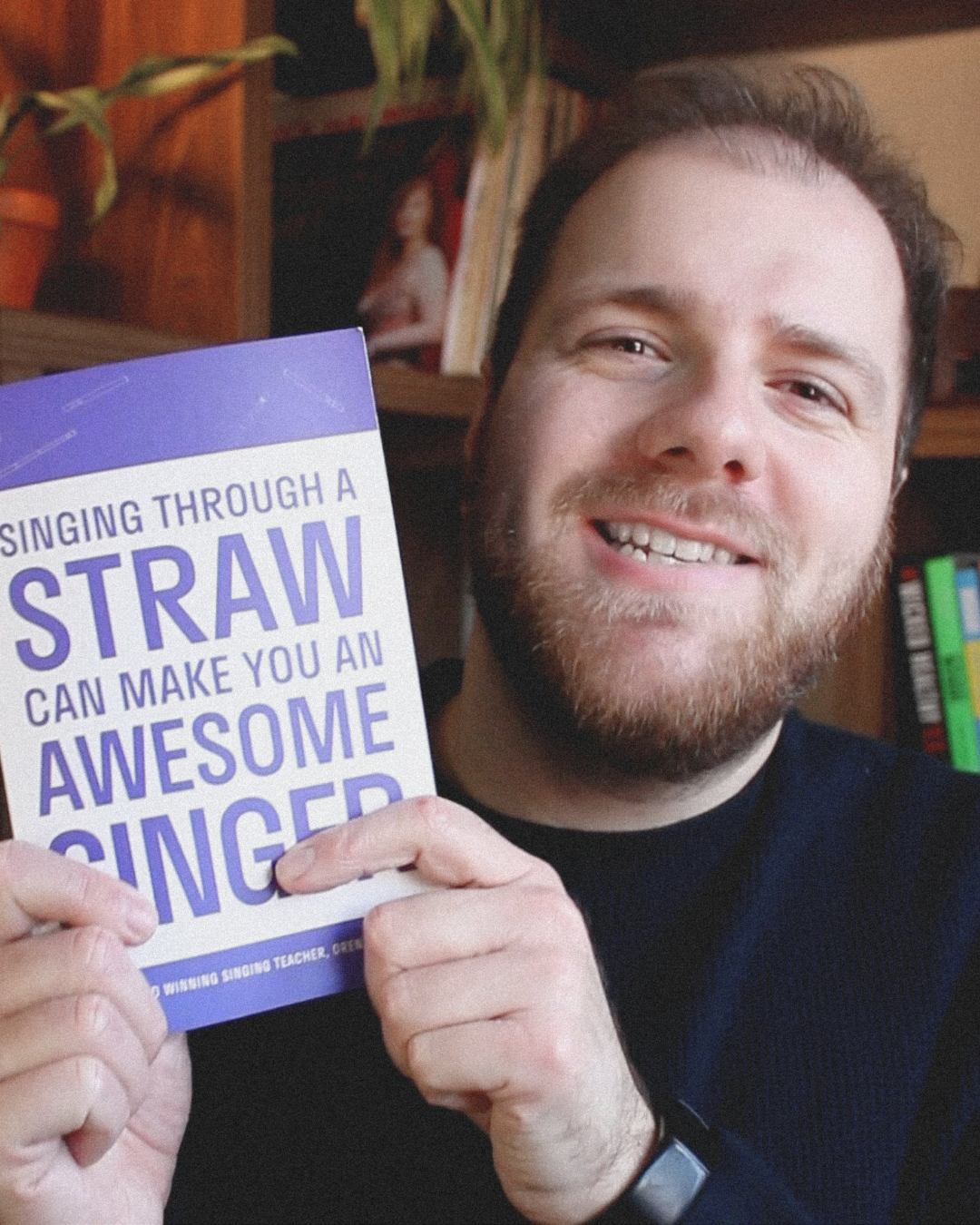 Oren Boder holding the Straw Singing Book